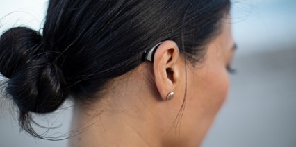 woman wearing livio ai hearing aids